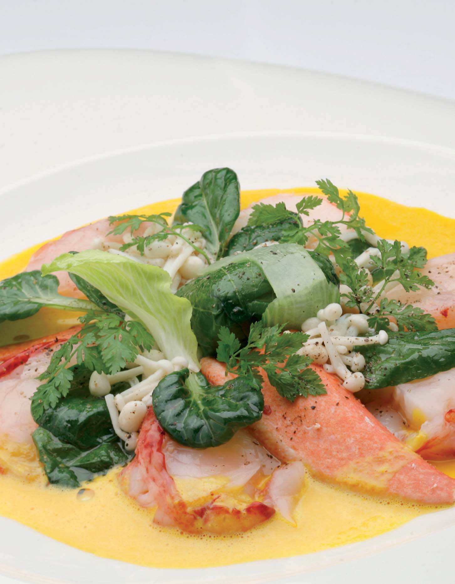 Medallions of Atlantic lobster with Pak Choi, Hierbas de Mallorca and Saffron Stock and Enoki mushrooms - Recipes - Gastronomy - Balearic Islands - Agrifoodstuffs, designations of origin and Balearic gastronomy